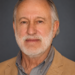 Headshot of author Ted Denmark